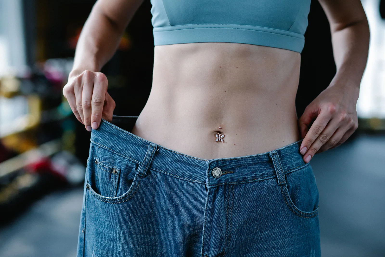 Loose jeans held away from the waist