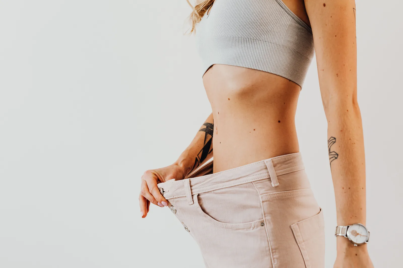 Loose trousers held away at the hip